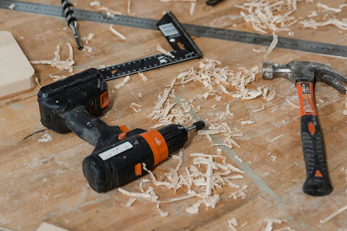 Tools over wood What Is Floor Refinishing and Why Does It Matter